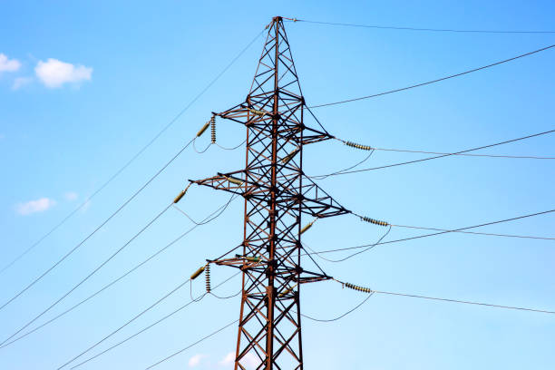 istock power line support with wires for electricity transmission. High voltage grid tower with wire cable at distribution station. Energy industry. 1559066155