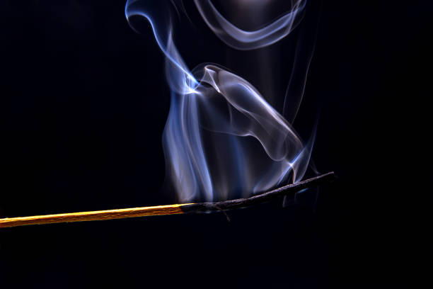 istock smoking match on a black background. Heat and light from fire flame 1559067186