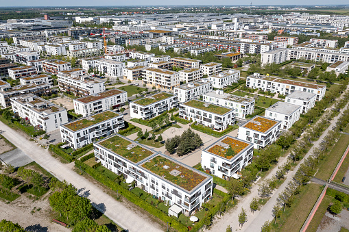 Aerial view of a large, modern residential district with apartment buildings and green areas.
