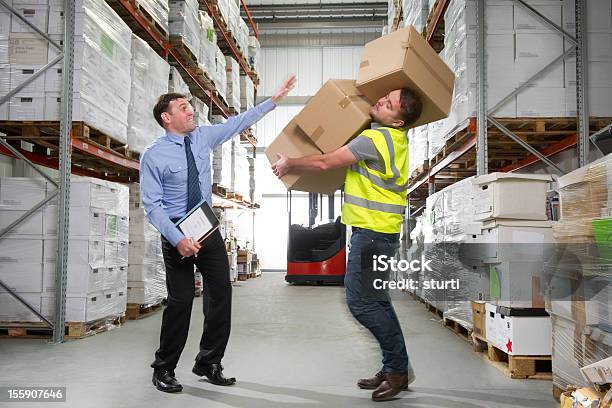 Warehouse Worker Dropping A Stack Of Boxes Stock Photo - Download Image Now - Falling, 20-24 Years, 20-29 Years