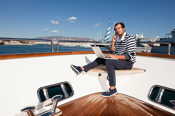 istock Yacht businessman working with laptop and discussing 155907896