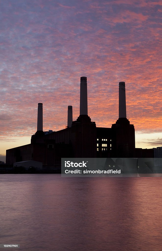Battersea Power Station At Dusk Evening in Battersea, and the sunset silhouettes the iconic Power Station. Battersea Power Station Stock Photo