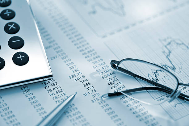 istock silver calculator, pen and glasses on sheet of financial data 155907977