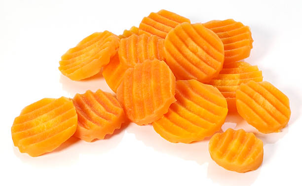 Carrot slices of different sizes isolated in white stock photo