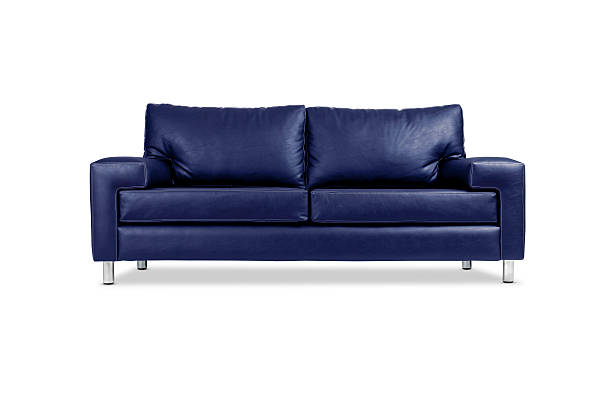 A blue leather sofa with silver legs Blue leather sofa, isolated with clipping path. leather couch stock pictures, royalty-free photos & images