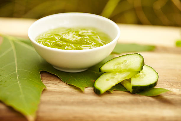 Seaweed facial product at spa with cucumber on maple leaf