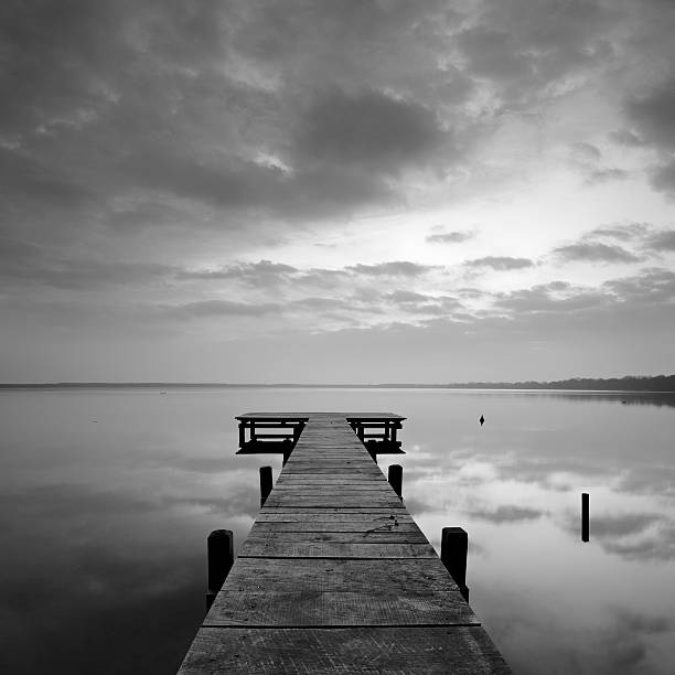 istock Small Dock on Calm Remote Lake at Sunrise 155908363