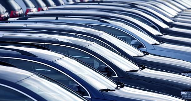New cars in a row at dealership close up with shallow depth of field of brand new cars domestic car photos stock pictures, royalty-free photos & images