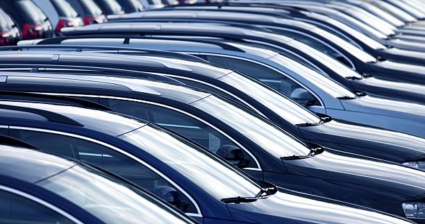 New cars in a row at dealership close up with shallow depth of field of brand new cars bmw dealership stock pictures, royalty-free photos & images