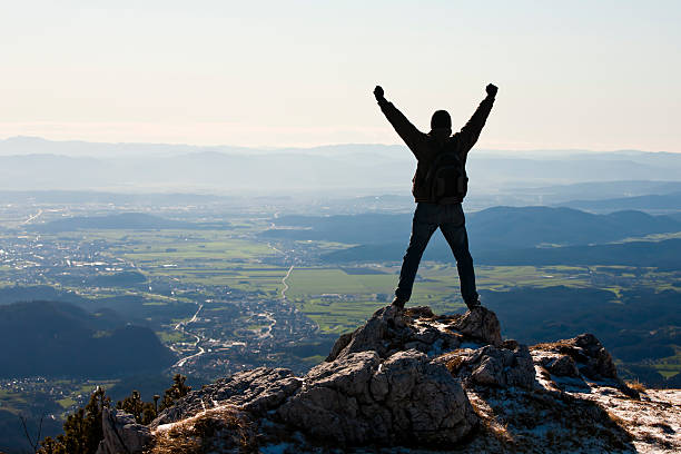 istock Happy mountaineer standing on the top 155908812