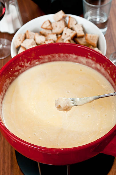 istock eating typical swiss cheese fondue 155908839