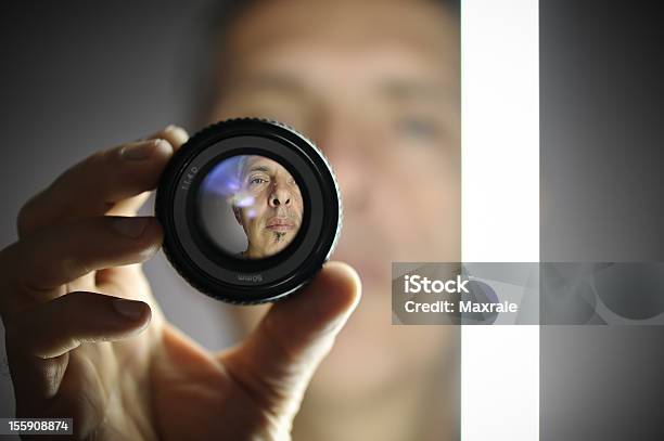 A View Of A Man Looking Through A Camera Lens Stock Photo - Download Image Now - Sharp, Defocused, Human Face