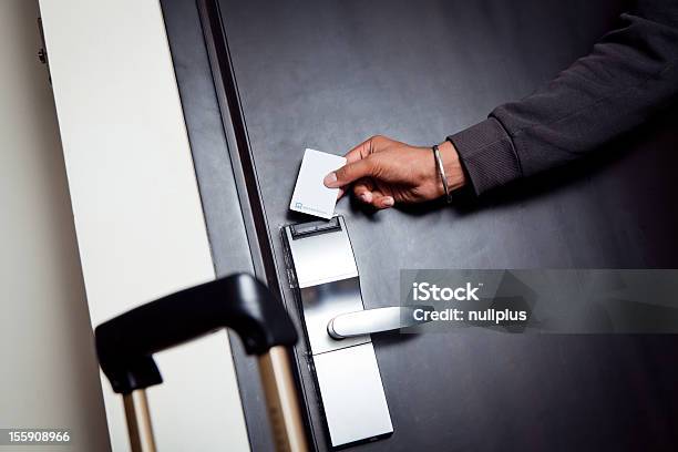 Young Indian Man Unlocking His Hotel Room Stock Photo - Download Image Now - Hotel, Door, India