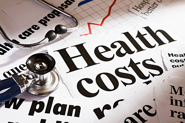 istock Health cost headlines, stethoscope and rising graph 155909151