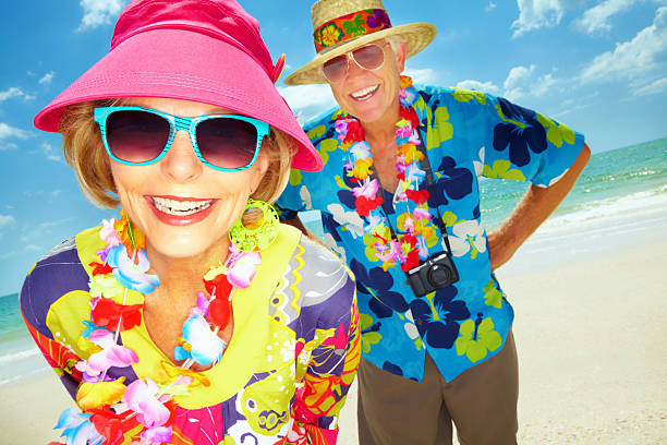 istock Happy retired couple vacationing at the beach  155909184