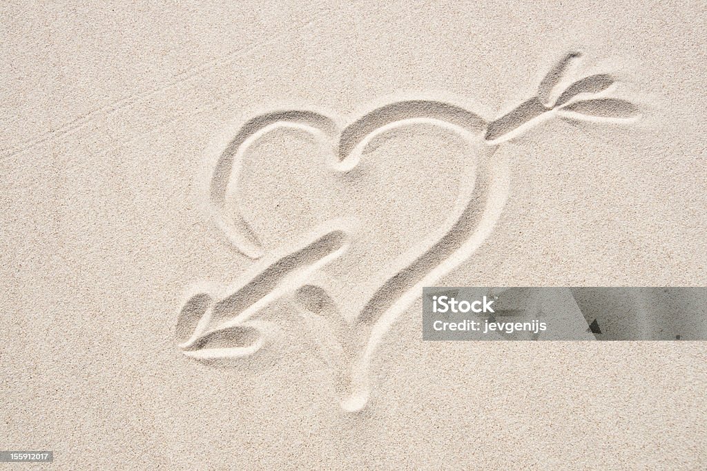The broken heart The broken heart sign on the sand Arrow - Bow and Arrow Stock Photo