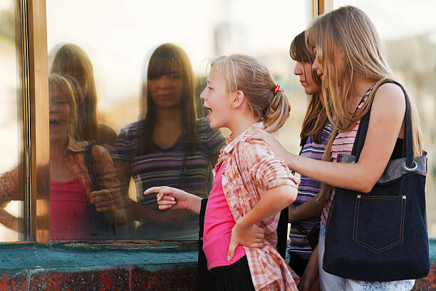istock Schoolgirls looking through a shop window 155912739