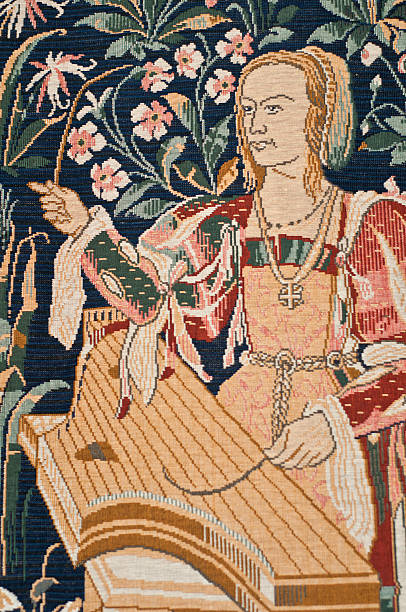 Medieval tapestry detail Detail of tapestry showing a Medieval woman playing a psaltery with a quill. tapestry photos stock pictures, royalty-free photos & images