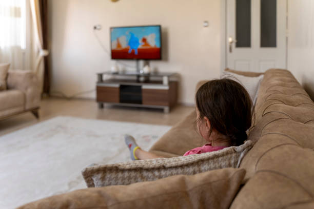 istock Girl watching cartoons. 1559135705