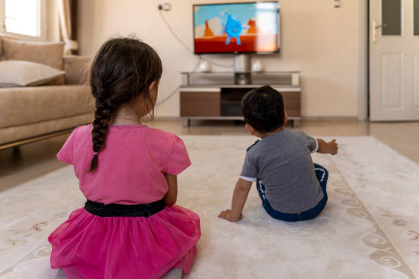 istock Children watching TV. 1559136773