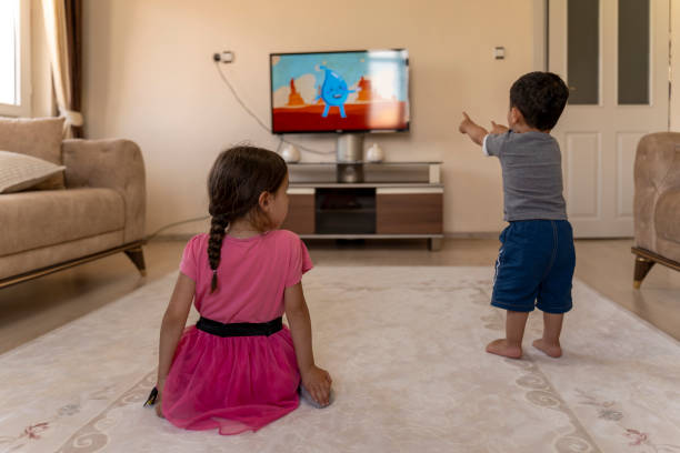 istock Children watching TV. 1559138887