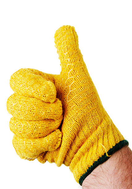 istock Mans Hand With Thumb Up In Yellow Work Glove 155915400