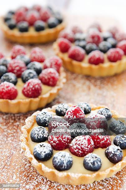 Icing Sugar On Fruit Tarts Stock Photo - Download Image Now - Baked, Baked Pastry Item, Berry Fruit