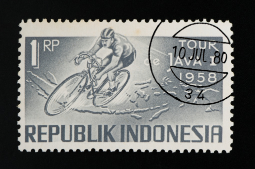 Republic of Indonesia postage stamp on black background. Studio Shot