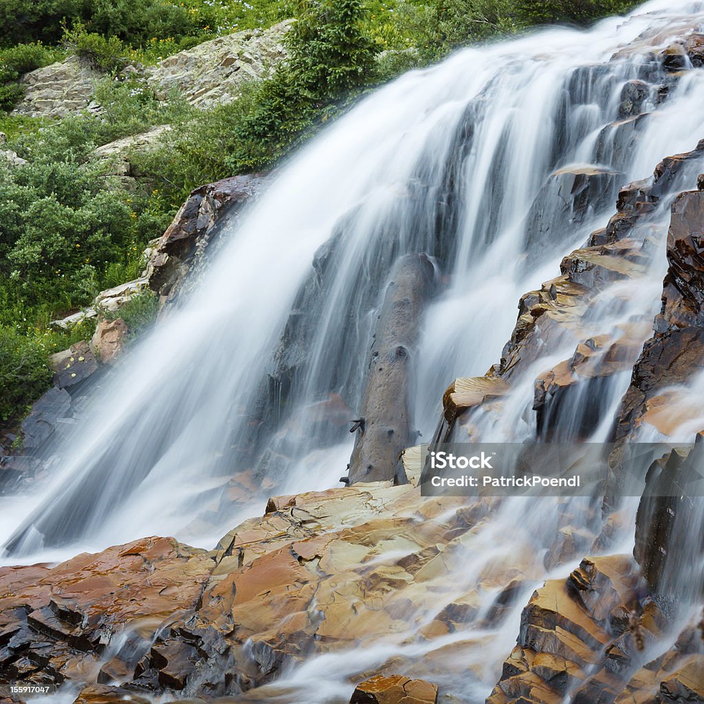 Cascading Waterfall Cascading waterfall in the Rocky Mountains, Colorado. Beauty In Nature Stock Photo