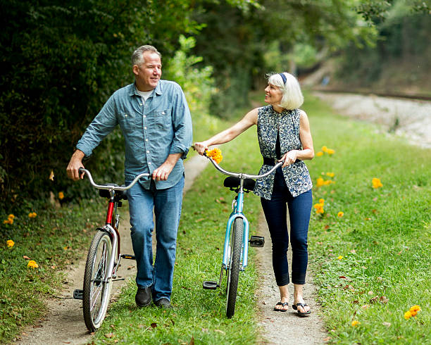 istock Mature Couple Walking With Bicycles At Park. 155917054