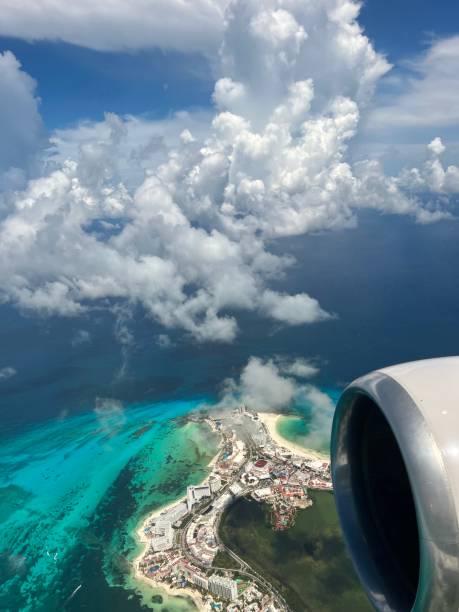 istock Flying over Caribbean Turquoise Water - Cancun, Mexico 1559185021