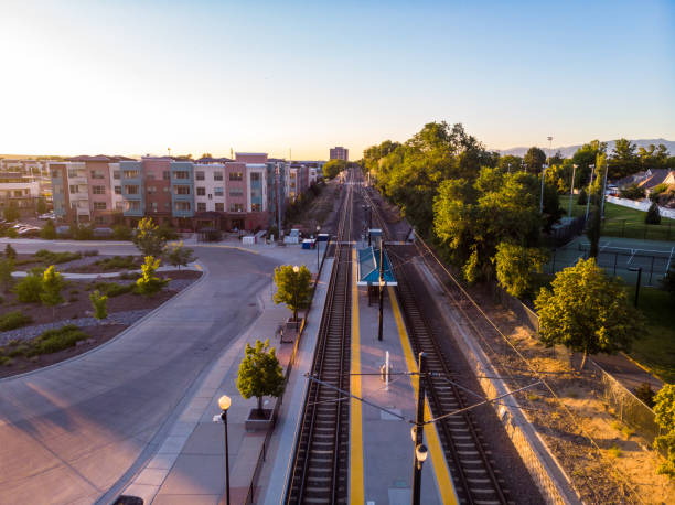 istock Serene rail station, mountains afar, warm summer, immaculate grounds, picturesque view. 1559191180