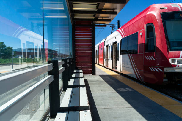 Immaculate rail depot, warm summer day, breathtaking mountain scenery.