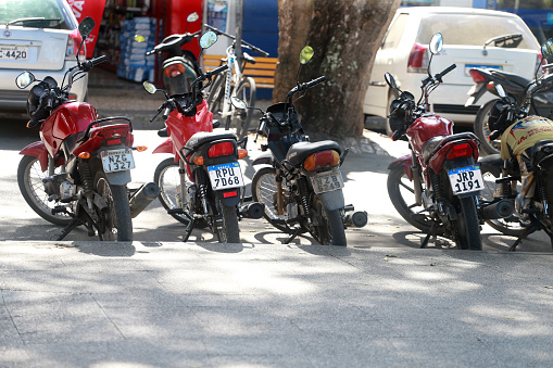 cruz das alma, bahia, brazil - july 17, 2023: Parking of motorcycles in a square in the city of Cruz das Almas.