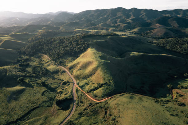 istock Dirt road in rural landscape 1559325244