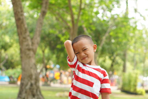 istock Happy boy in the park 1559385729