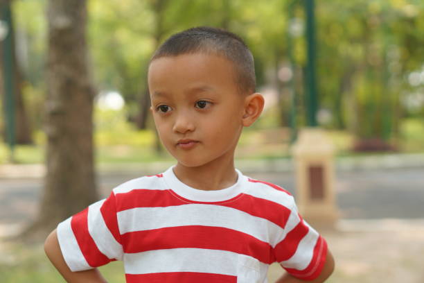 istock Happy boy in the park 1559386491