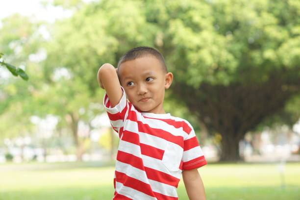 istock Happy boy in the park 1559386823