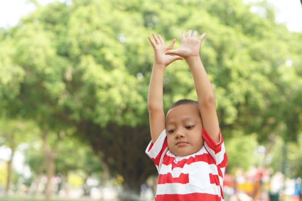 istock Happy boy in the park 1559388447