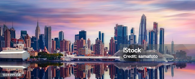 istock New York City, Manhattan downtown skyline at dusk with skyscrapers over Hudson River, 1559399358