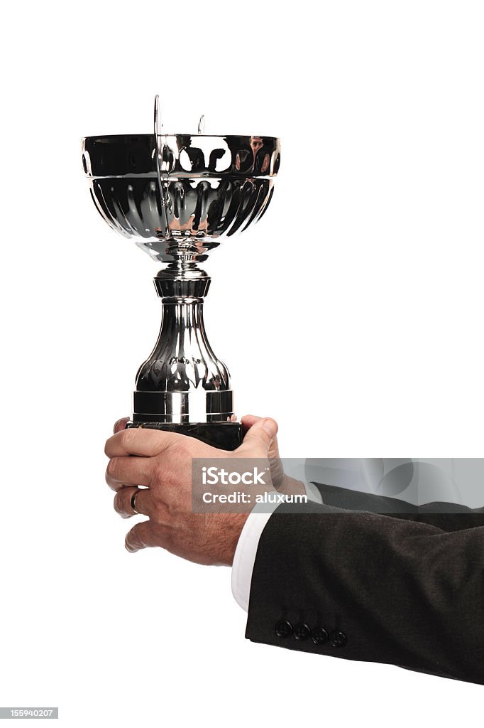 Uomo d'affari tenendo il trofeo - Foto stock royalty-free di Businessman