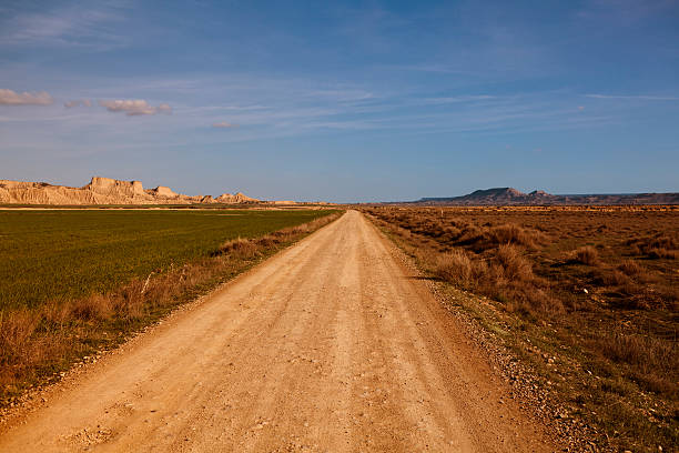 istock dirt track through Bardenas Reales desert Spain 155941708