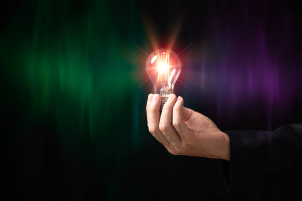 istock Businessman hand holding creative light bulb with power line technology, analysis solution and development, Modern business, Innovative of new ideas. 1559437841