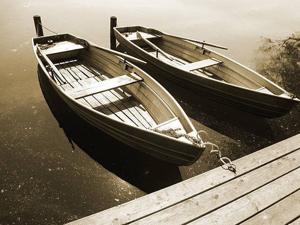 istock boat on the lake, sepia 155950988