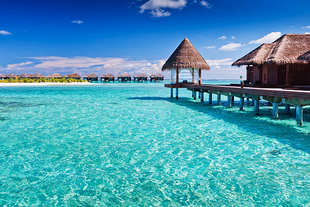 Overwater spa in blue lagoon around tropical island