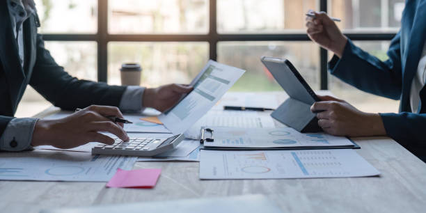 istock Business team analyzing income charts and graphs with modern laptop computer and digital tablet. Close up. Business analysis and strategy concept 1559536617