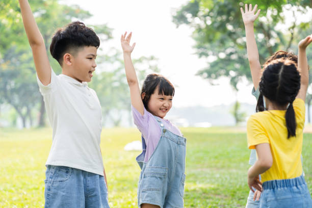 istock group image of asian children having fun in the park 1559537146