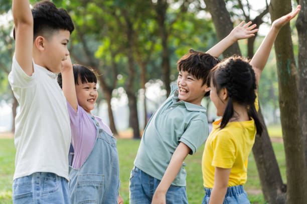 istock group image of asian children having fun in the park 1559537149