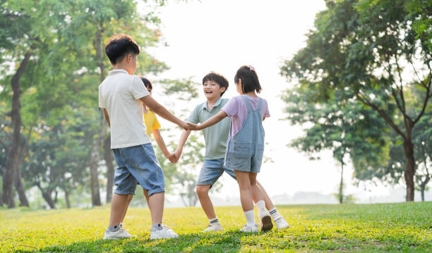 istock group image of asian children having fun in the park 1559538233