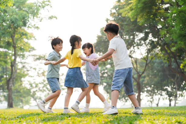 istock group image of asian children having fun in the park 1559538764